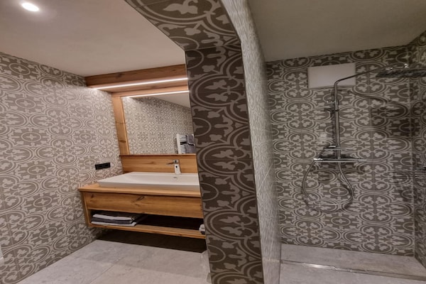 Foto van Chalet in Grosskirchheim met sauna en bubbelbad - Vakantiehuis in Grosskirchheim - BathRoom