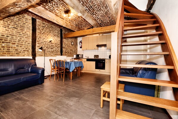 Foto van Mooi appartement in monumentale carré-boerderij tussen Luik en Maastricht - LivingRoom