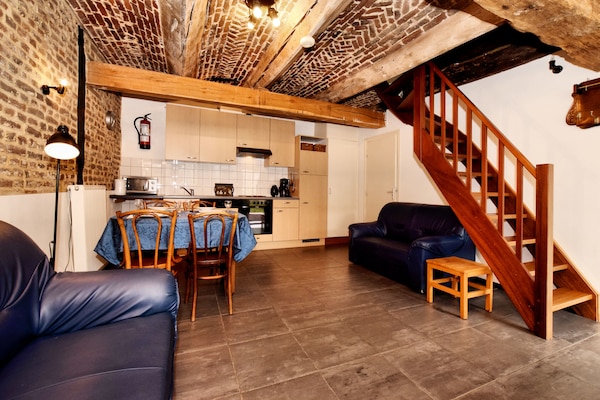 Foto van Mooi appartement in monumentale carré-boerderij tussen Luik en Maastricht - LivingRoom