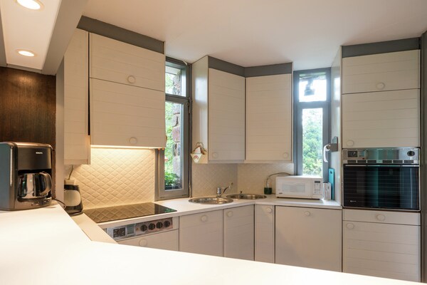 Foto van Vrijstaande vakantiewoning in de Ardennen met biozwembad - Kitchen