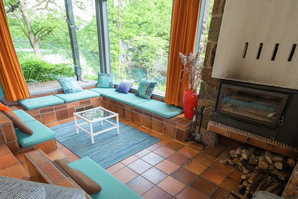 Foto van Vrijstaande vakantiewoning in de Ardennen met biozwembad - LivingRoom