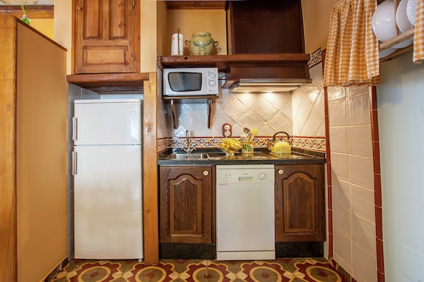 Foto van Cottage in Rute met zwembad en uitzicht - Vakantiehuis in Rute - Kitchen