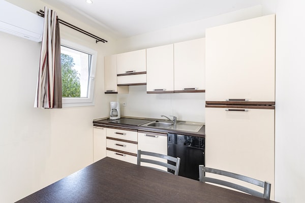 Foto van Wonen aan de kust en in de tuin op Corsica - Vakantiehuis in Sari-Solenzara - Kitchen