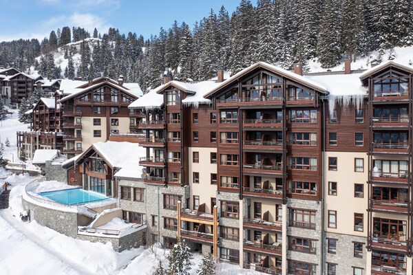Foto van Berguitzicht vakantiehuis met balkon voor 8 - Vakantiehuis in Flaine - ExteriorWinter