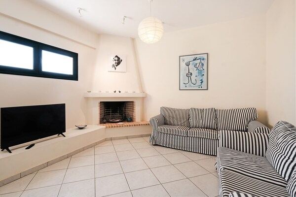 Foto van Villa bij Kissakas Strand met Zeezicht - Vakantiehuis in Pera Melana - LivingRoom