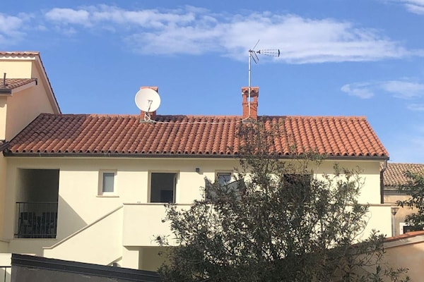 Foto van Appartement met gezellige slaapkamer - Vakantiehuis in Porec - ExteriorSummer