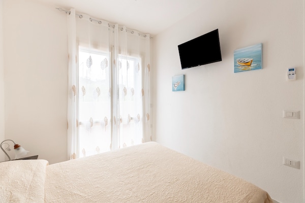 Foto van Zwembad condivisa en giardino privato - Vakantiehuis in Badesi - BedRoom