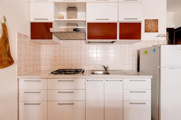 Foto van Met terras met uitzicht op zee en airconditioning. - Kitchen