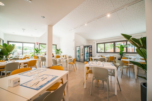 Foto van Lodge in het familiedorp Rimini vlakbij het strand - DiningRoom