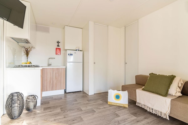 Foto van Lodge in het familiedorp Rimini vlakbij het strand - LivingRoom