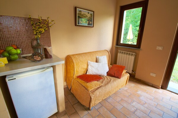 Foto van Appartement in Marche met Zwembad en Uitzicht - Vakantiehuis in Apecchio - LivingRoom