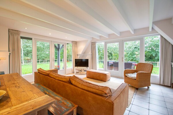 Foto van Sandepark 151 villa voor 8 personen met grote tuin - LivingRoom
