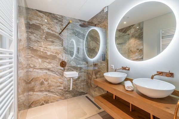 Foto van Uitnodigend appartement met tuin - Vakantiehuis in Sint Maartenszee - BathRoom