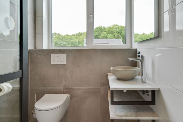 Foto van Bungalow op Texel bij Nationaal Park Duinen - Vakantiehuis in De Koog Texel - BathRoom