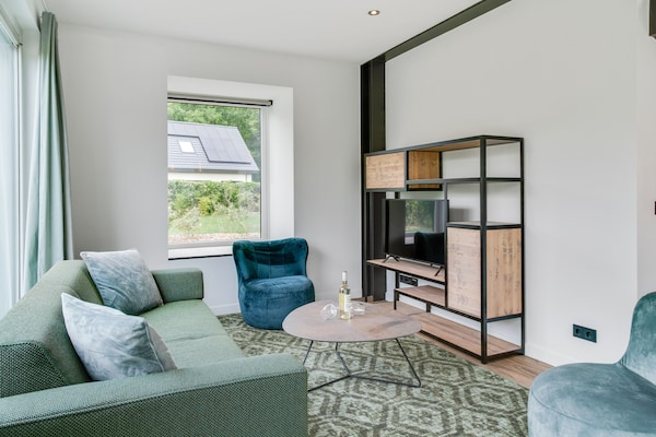 Foto van Bungalow op Texel bij Nationaal Park Duinen - Vakantiehuis in De Koog Texel - LivingRoom
