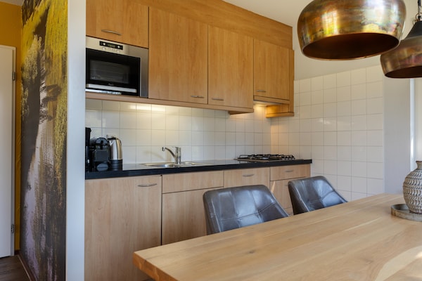 Foto van Weelderige bungalow met privé-bubbelbad - Vakantiehuis in Diessen-Baarschot - Kitchen