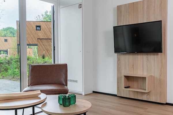 Foto van Lodge in Schaijk bij Vakantiepark - Vakantiehuis in Schaijk - LivingRoom