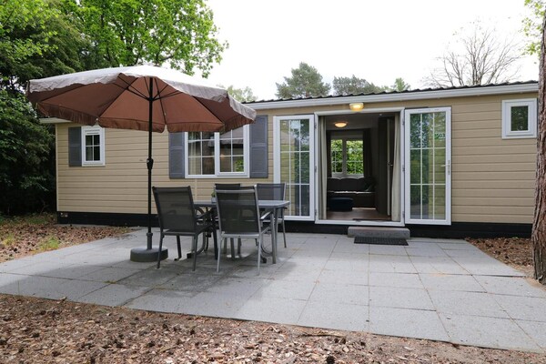 Foto van Vrolijke stacaravan op de Veluwe - Vakantiehuis in Otterlo - TerraceBalcony