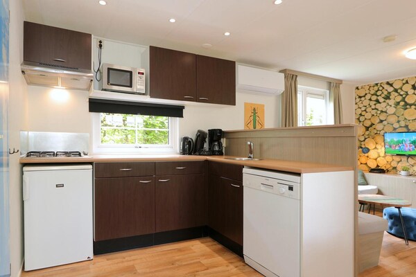 Foto van Vrolijke stacaravan op de Veluwe - Vakantiehuis in Otterlo - Kitchen