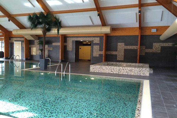 Foto van Chalet met groen en terras - Vakantiehuis in Otterlo - PoolOfHouse