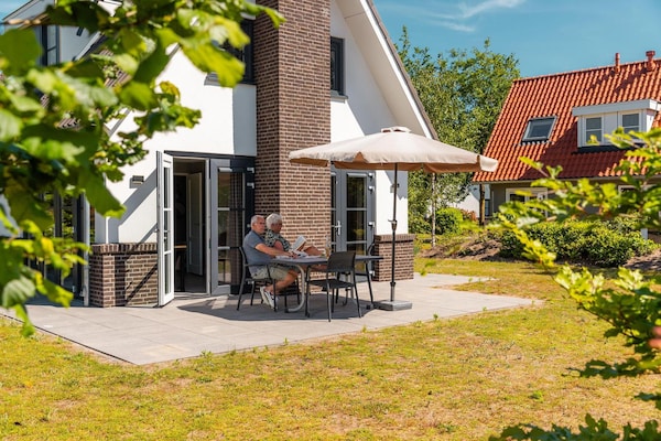 Foto van Chalet met één verdieping en veranda - Vakantiehuis in Lochem - TerraceBalcony