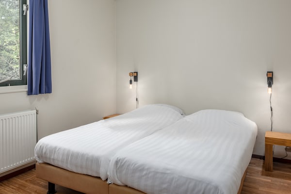 Foto van Chalet met vaatwasser nabij natuurreservaat - Vakantiehuis in Borger - BedRoom